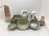Assortment of pottery items. Includes bowls, wind