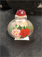 Snuff bottle with reverse painted flowers.