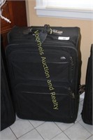 Samsonite medium size rolling suitcase