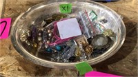 Bowl of assorted jewelry
