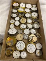 Pocket watch movements in metal containers