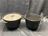 Two cast-iron pots, one with lid and feet