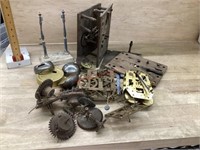 Box of clock parts.  Backs/ workings and misc
