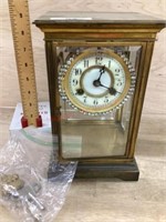 Antique clock in brass and glass case  Maker