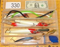 Grouping of Large Fishing Lures in Tackle Case