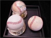 Three autographed baseballs: one with Ned Garver