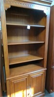 Ethan Allen dark wood bookcase with storage on