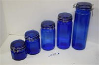Five Blue Glass Canisters