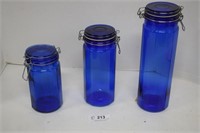 Three Blue Glass Canisters