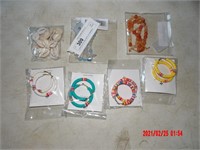 3 NECKLACES AND 4 SETS OF EARRINGS