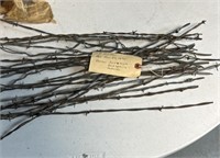 MISC BARBED WIRE PIECES WITH A NOTE