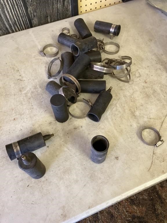 Rubber pieces, some with nozzles and hose clamps