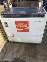 Coke machine has 15 cent coin slot