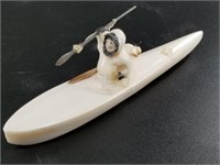 Walrus ivory carved kayaker by member from Aningay