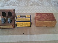 Vintage shell boxes and biting bullets