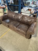 Brown faux leather couch