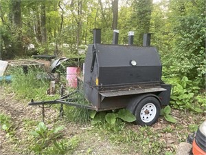 mobile Smoker w/ wood storage on the side.