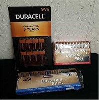 Package of Duracell 9 volt, Kirkland AAA and