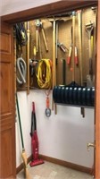 All Long Handle Garden Tools hanging in Garage