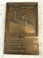 4“ x 2 1/2” bronze plaque commemorating the first