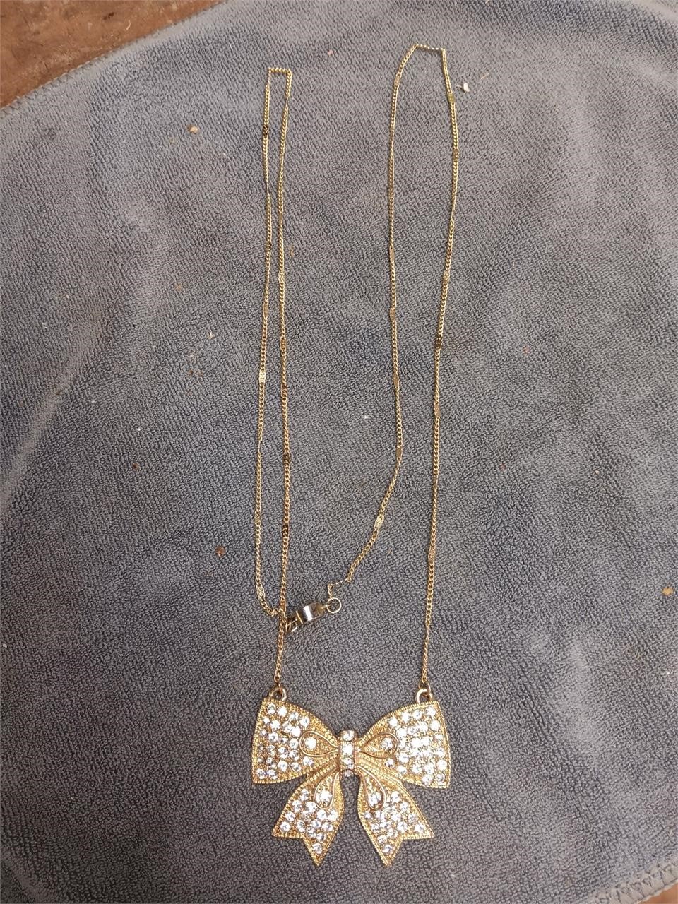 Gold Toned Bow & Clear Stones Necklace & Pendant