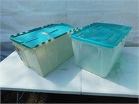 Two 15 gallon size flip top storage containers.