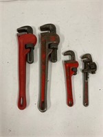 4 pipe wrenches.