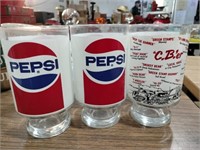 2 jumbo large Pepsi glasses and  advertisement