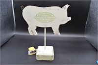 Pig on a stand with potted meats logo