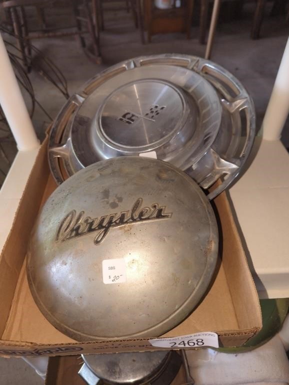Two vintage hubcaps 1 Chevy 1 Chrysler