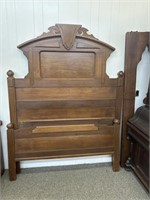 Antique Eastlake walnut bed from the 1890s has