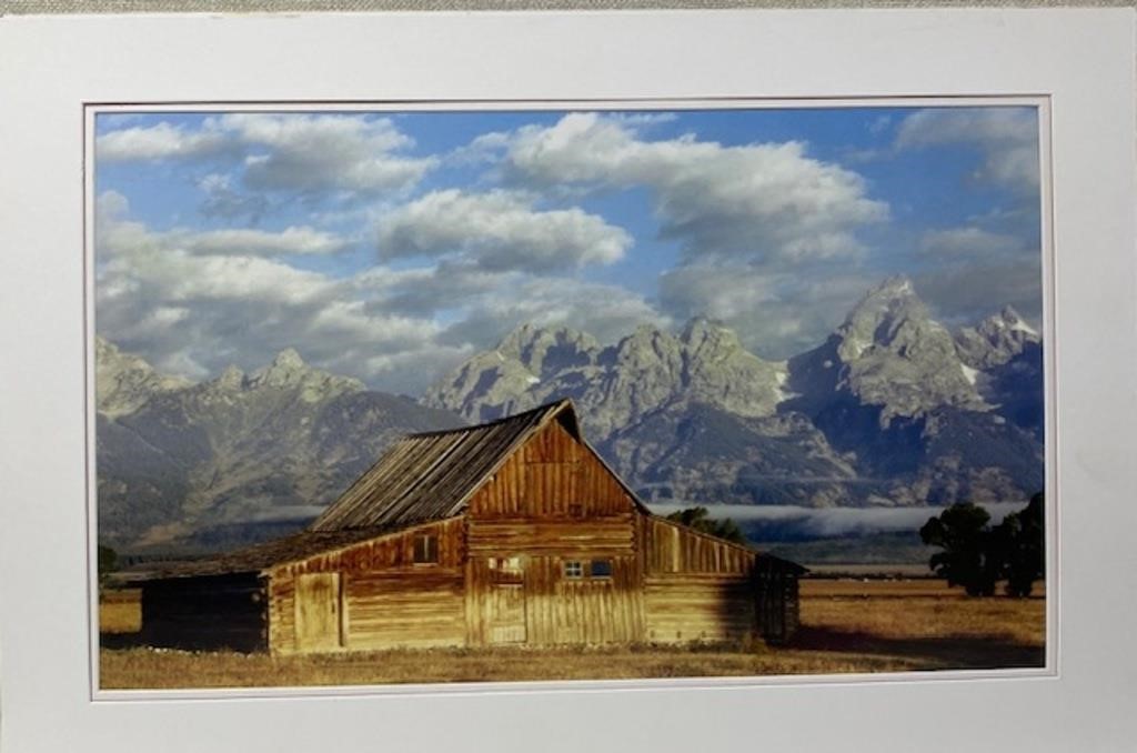 Photo Of Log Barn with mountains in background