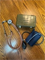 Vintage first aid kit, stethoscope, pressure cuff
