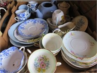 assorted dishes blue teacups & saucers