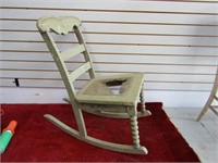 Small child's cane seat rocking chair.