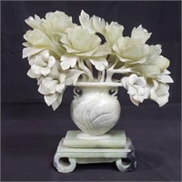 Jadite floral sculpture on carved stone base