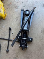 Lot with used car jack and tire iron