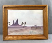 Framed desert landscape painting by Juan nakai