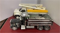 Two plastic toy trucks - one Penske utility