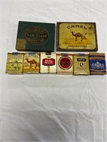 6 cigarette packs and 2 tins
