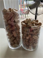 Glass containers full of corks 8” and 12”