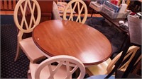 Round pedestal table with mahogany top and