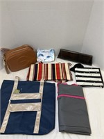 Variety of purses/clutch bags and wallets.