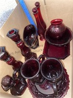 Box of ruby red Avon glassware