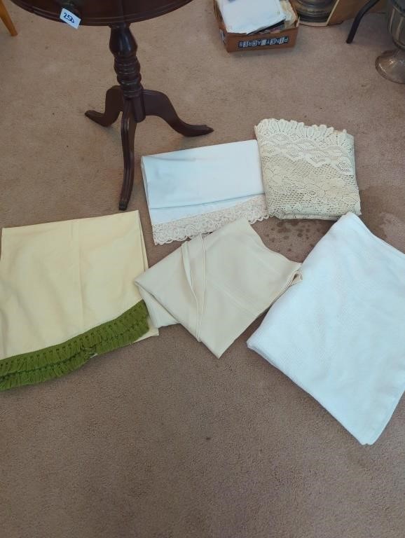 5 tablecloths, some with stains