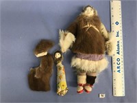 10" eskimo doll with various furs and a baby doll,