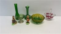 Assorted green glass with 2 Hummel figurines.