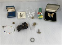 Assorted costume jewelry and locomotive pencil