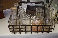 ANTIQUE MILK CARRIER WITH 6 MILK BOTTLES