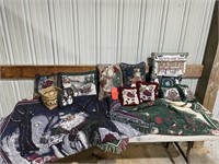 Lot of Christmas pillows, blankets, and basket